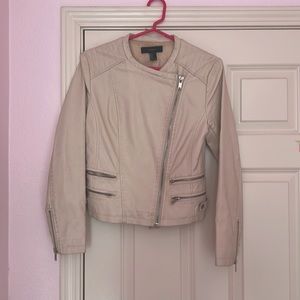 Cream vegan leather jacket with silver zippers and hardware.